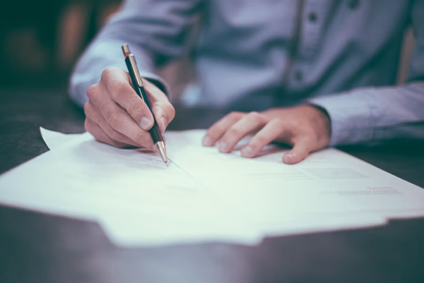 Signing paperwork on a tablet